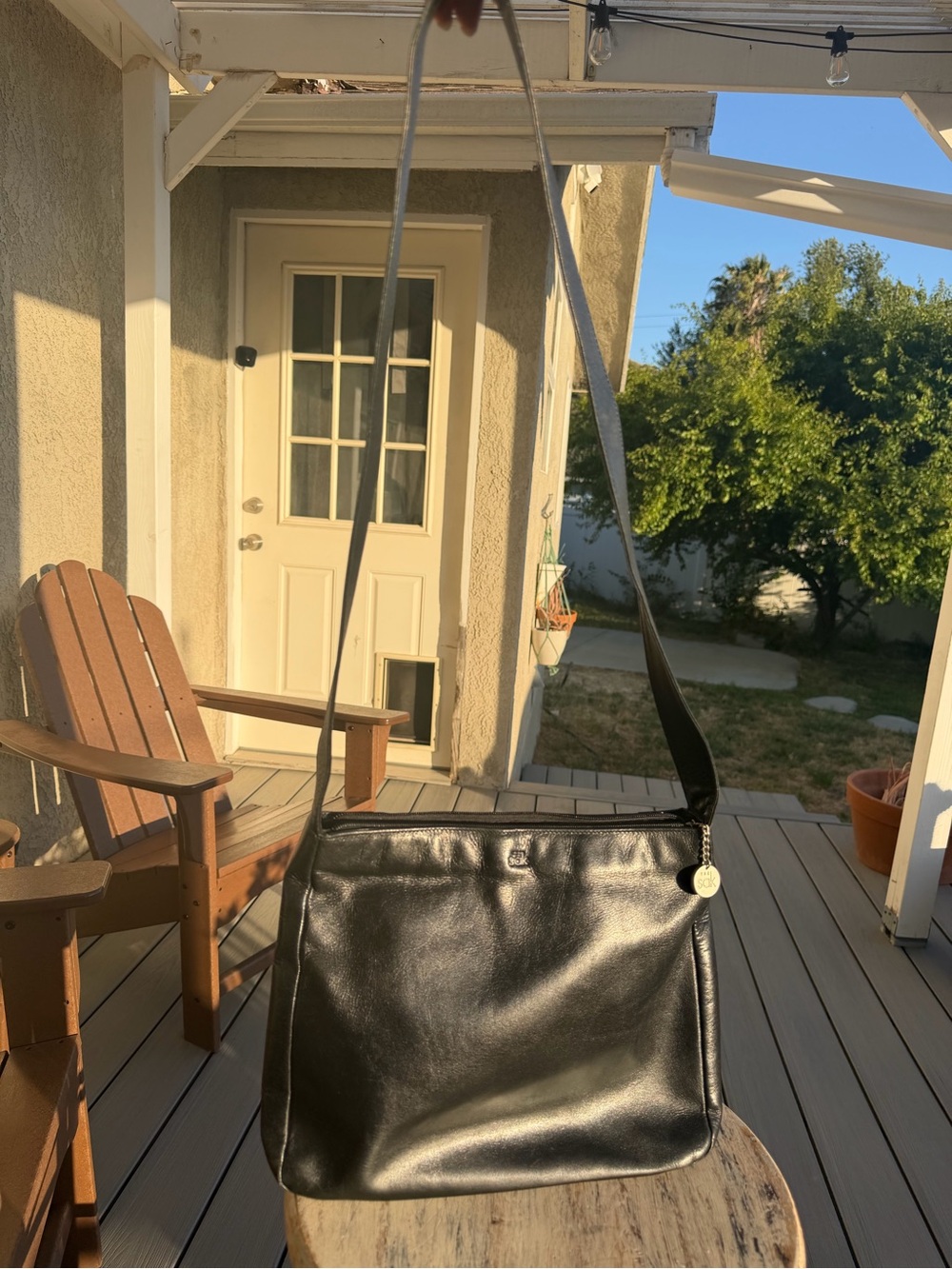 The Sak Black Leather Crossbody with Gold Charm